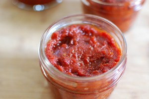 I generally press a strip of plastic wrap onto the surface of the paste before I seal the jar, just to help keep freezer burn at bay. 