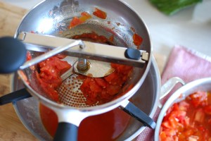 Miller Time. If you don't have a food mill, use the back of a wooden spoon to press the cooked tomatoes through a fine-mesh sieve.
